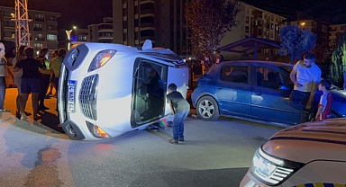 Yan yatan aracın altında kalmaktan son anda kurtuldu